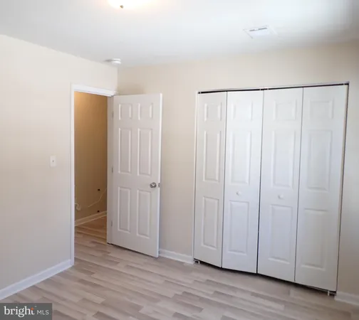 a view of a livingroom with wooden floor