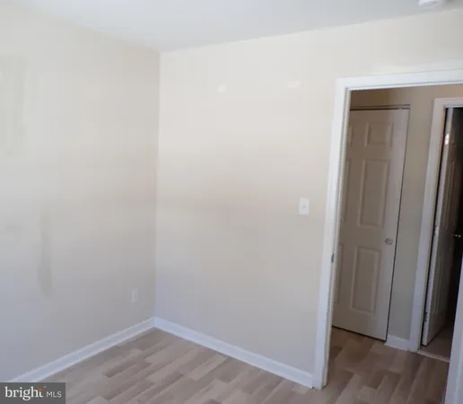 a view of small space with wooden floor