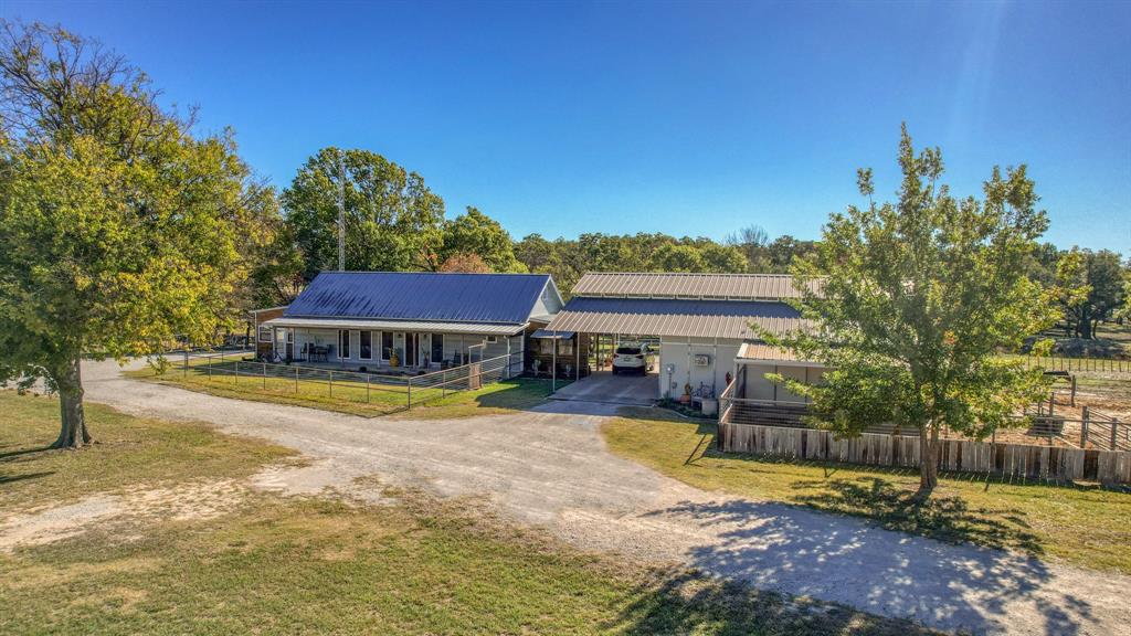 4200 Farm To Market 920 Weatherford, TX 76088 - Photo 1 of 1 a view of swimming pool with lawn chairs and wooden fence