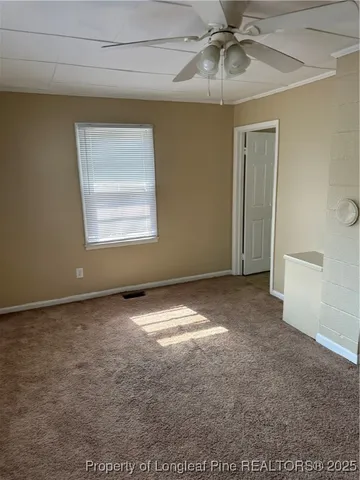 a view of an empty room with a window