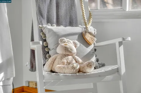 a view of a patio with table and chairs and potted plants