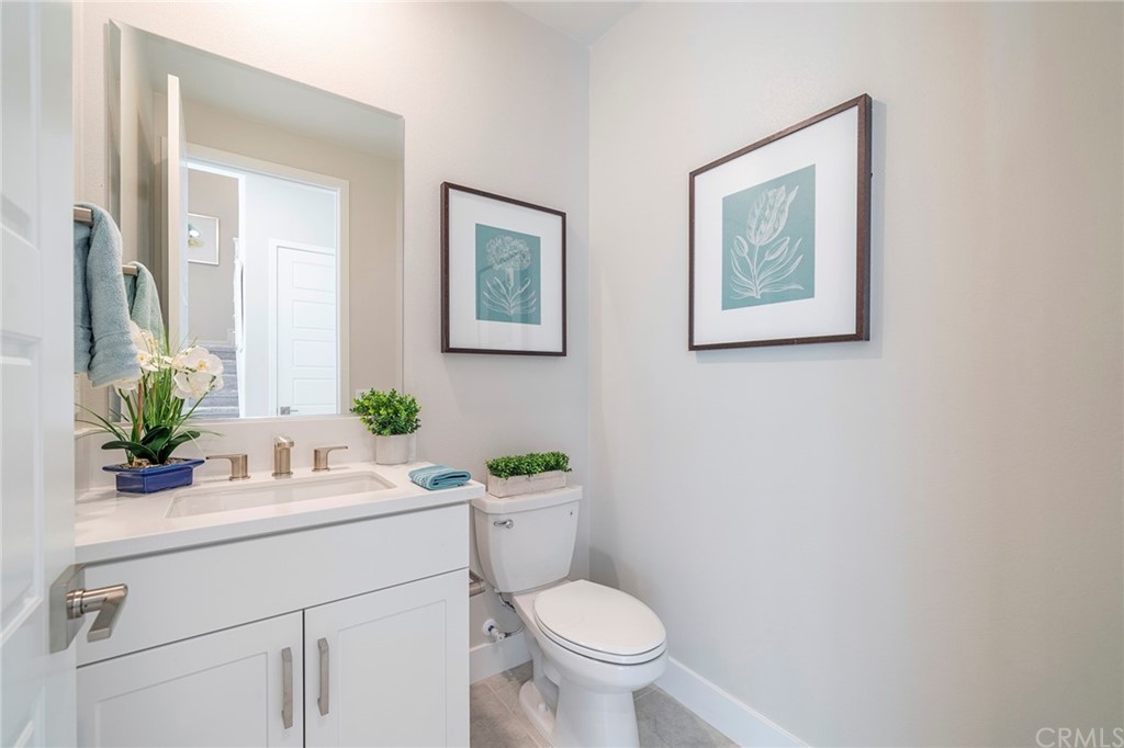 219 Chorus Irvine, CA 92618 - Photo 10 of 24 a bathroom with a toilet sink and mirror