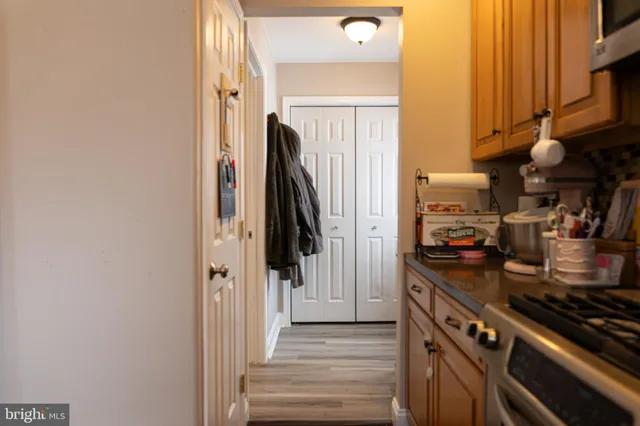 a kitchen with a refrigerator and a stove