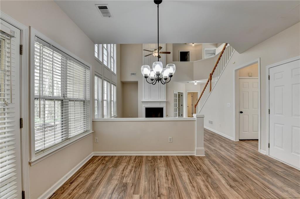 100 Hawnley Trc Northwest Suwanee, GA 30024 - Photo 29 of 58 a view of a livingroom with a chandelier