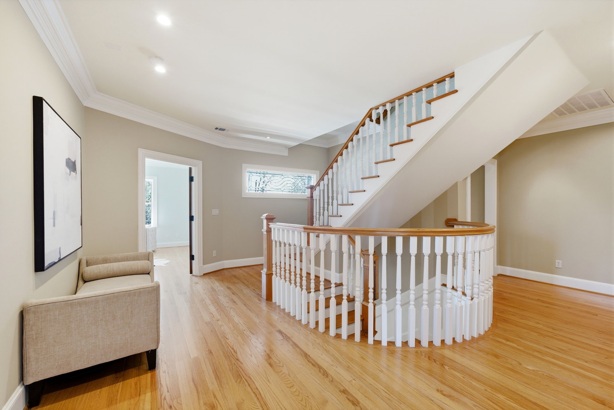 607 East 15th Street Houston, TX 77008 - Photo 22 of 50 2nd floor landing showing decorative stairway, and one of the 4 bedrooms on this level, being used as a study/office with double doors.