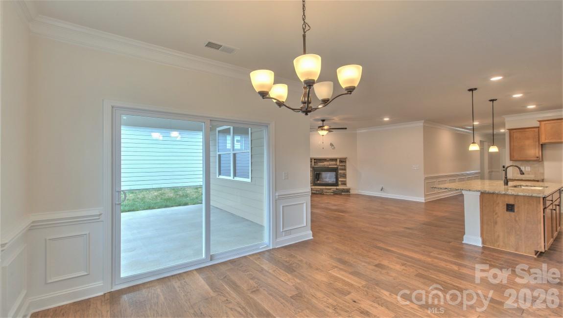 649 River Btm Road Fletcher, NC 28732 - Photo 8 of 40 a view of a kitchen with a sink wooden floor and staircase
