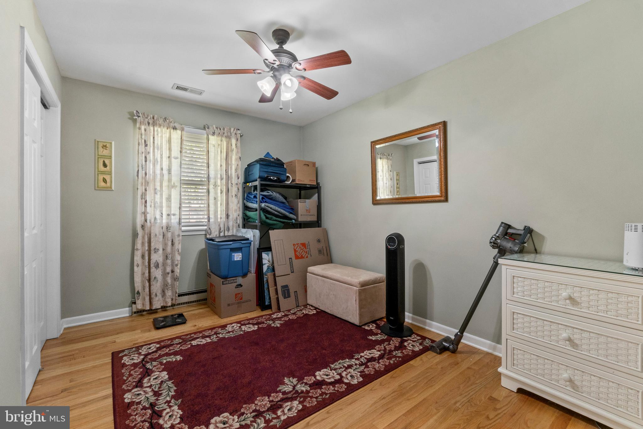 1706 Abelia Road Fallston, MD 21047 - Photo 20 of 41 a bedroom with a bed and wooden floor