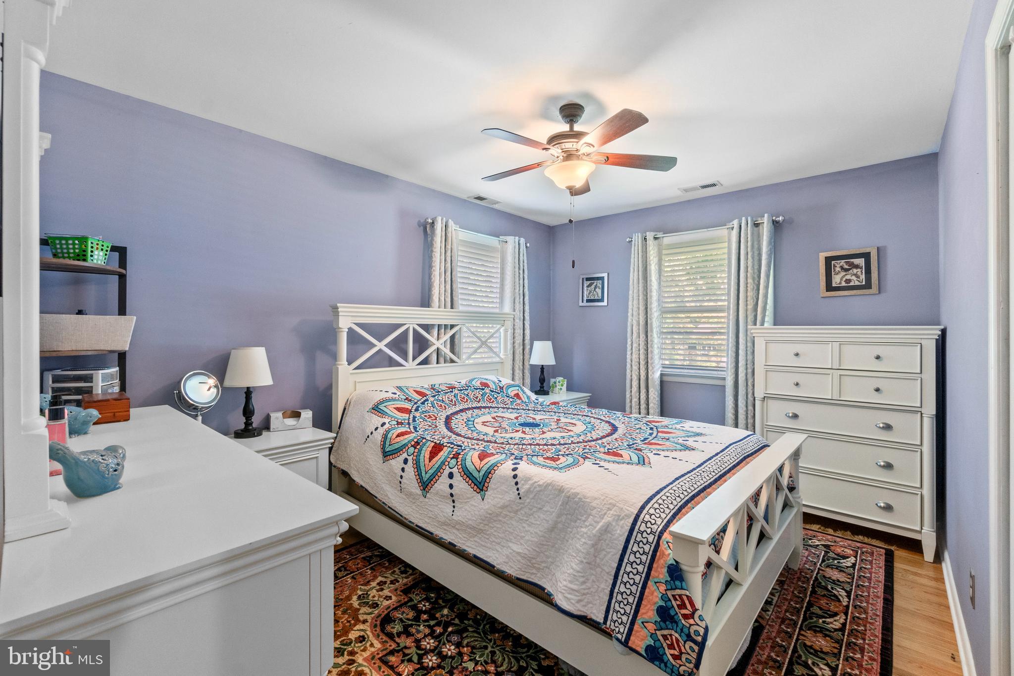 1706 Abelia Road Fallston, MD 21047 - Photo 24 of 41 a bedroom with a bed and a chandelier