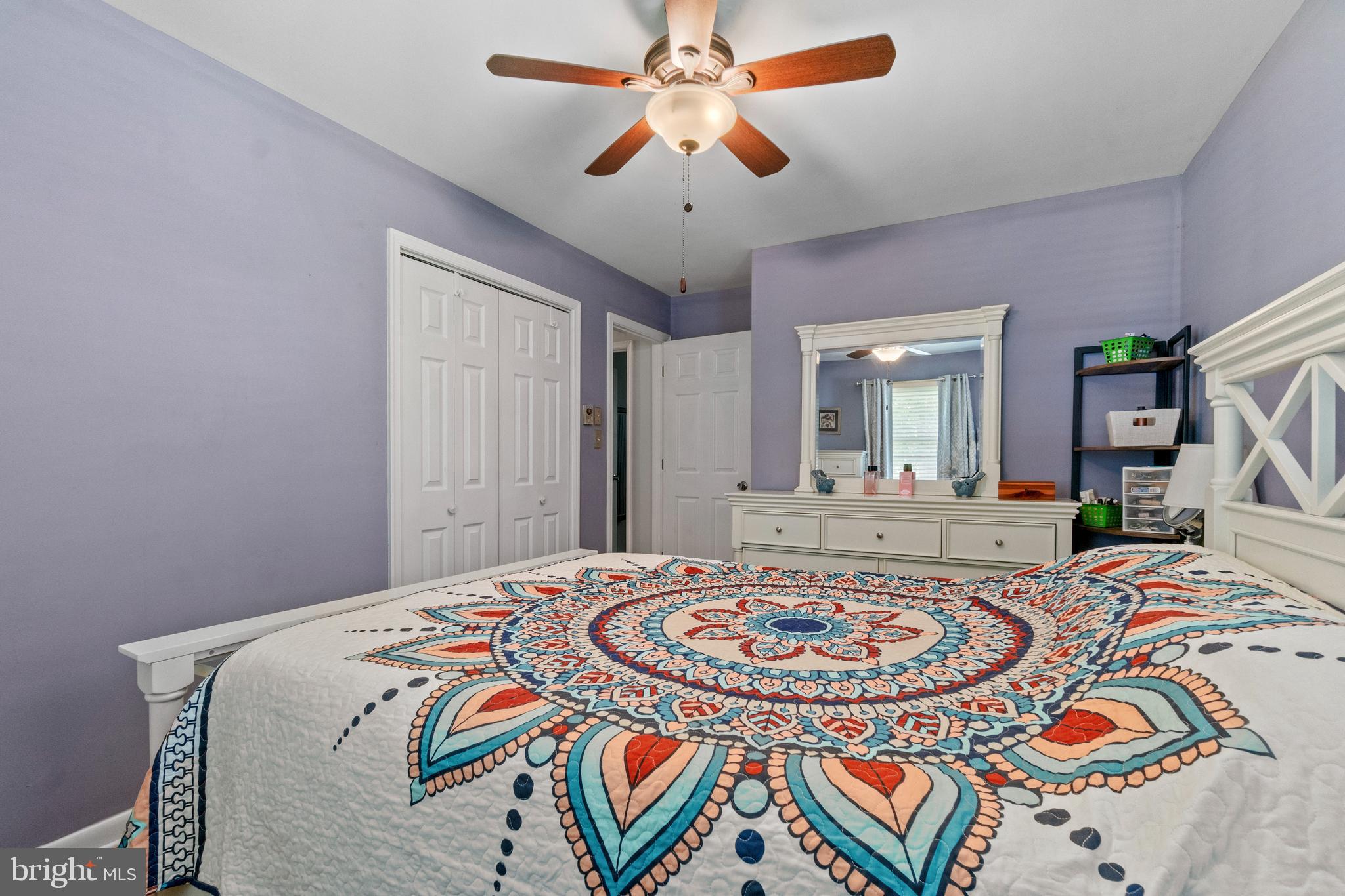 1706 Abelia Road Fallston, MD 21047 - Photo 25 of 41 a bedroom with a bed and a chandelier