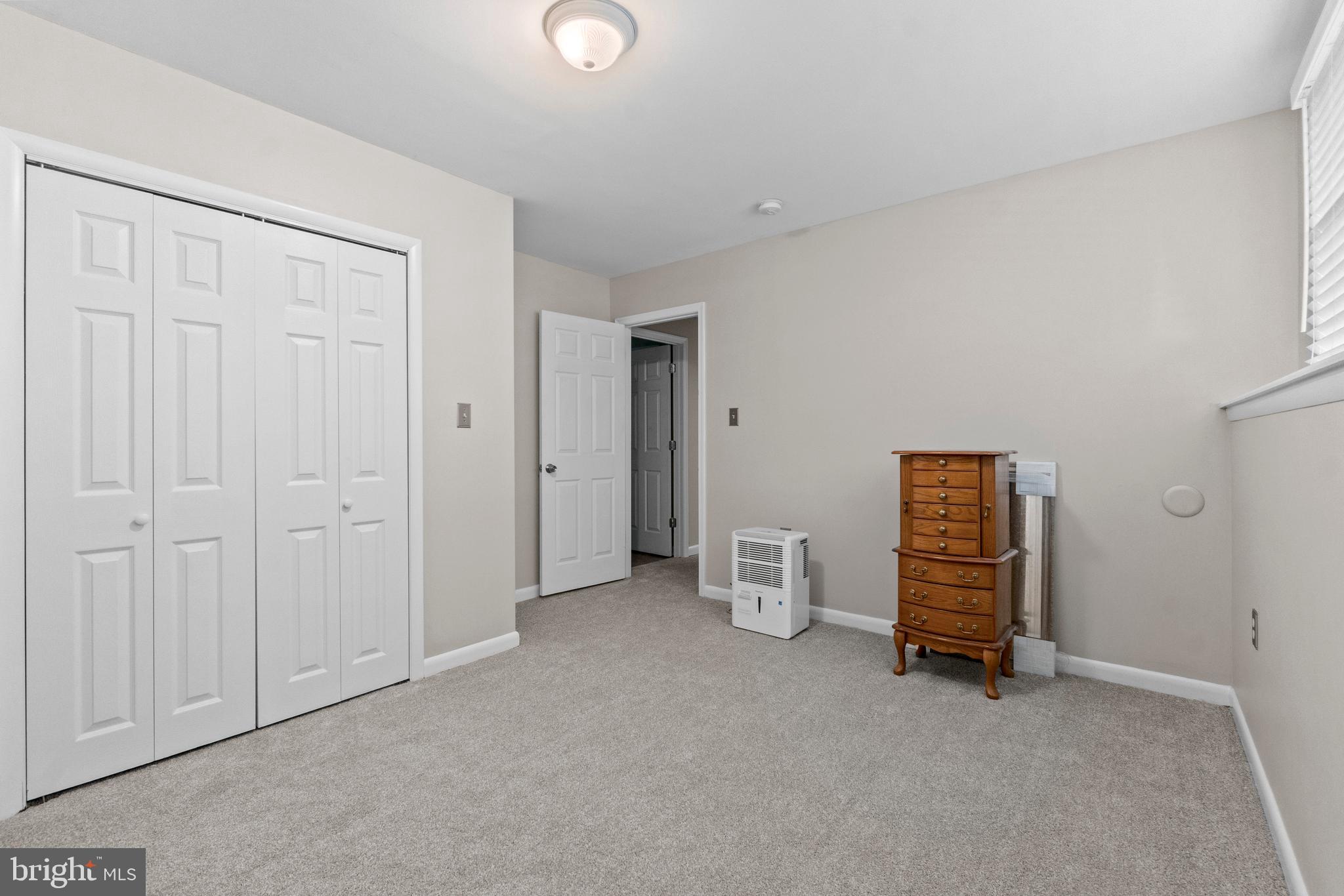 1706 Abelia Road Fallston, MD 21047 - Photo 35 of 41 an empty room with chair and closet
