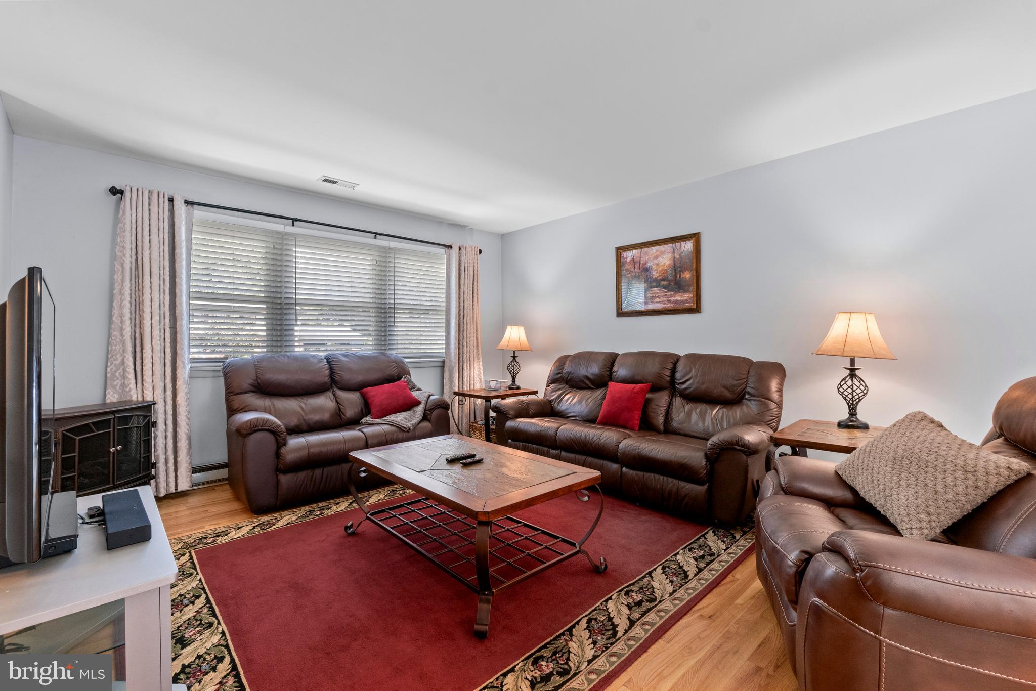 1706 Abelia Road Fallston, MD 21047 - Photo 7 of 41 a living room with furniture a rug and a window