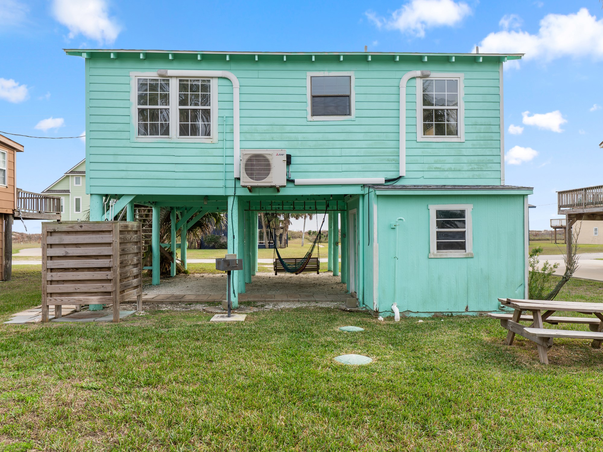 575 Beach Front Drive Matagorda, TX 77457 - Photo 27 of 39 a view of a house with a yard and sitting area