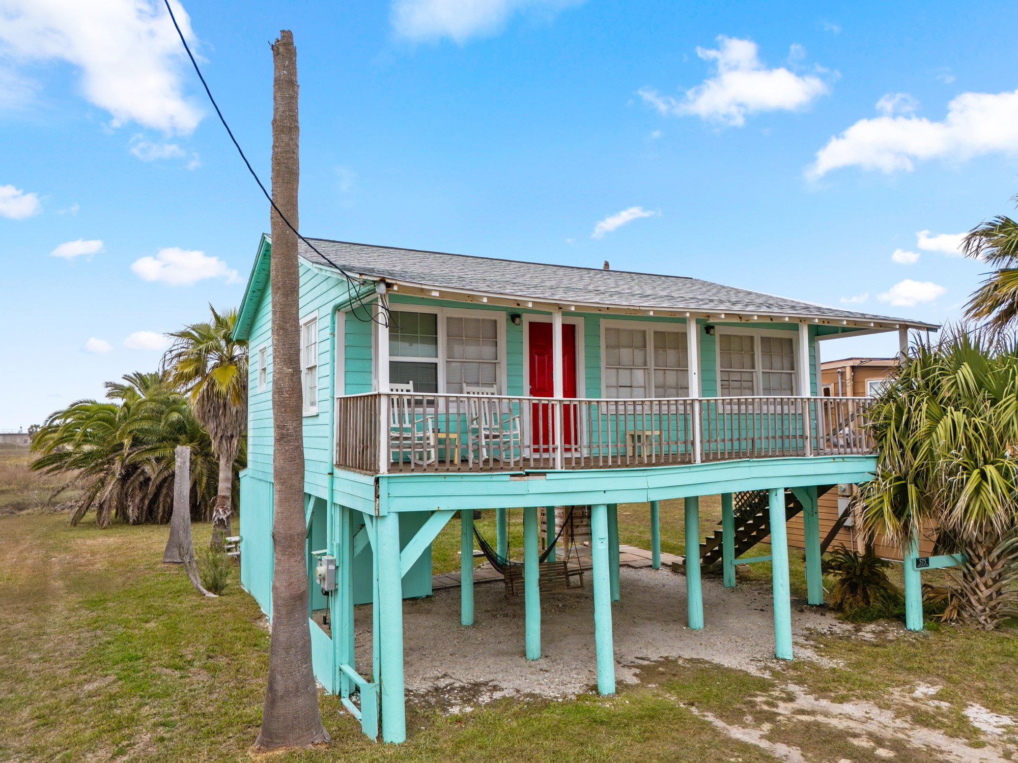 575 Beach Front Drive Matagorda, TX 77457 - Photo 4 of 39 a backyard of a house with table and chairs