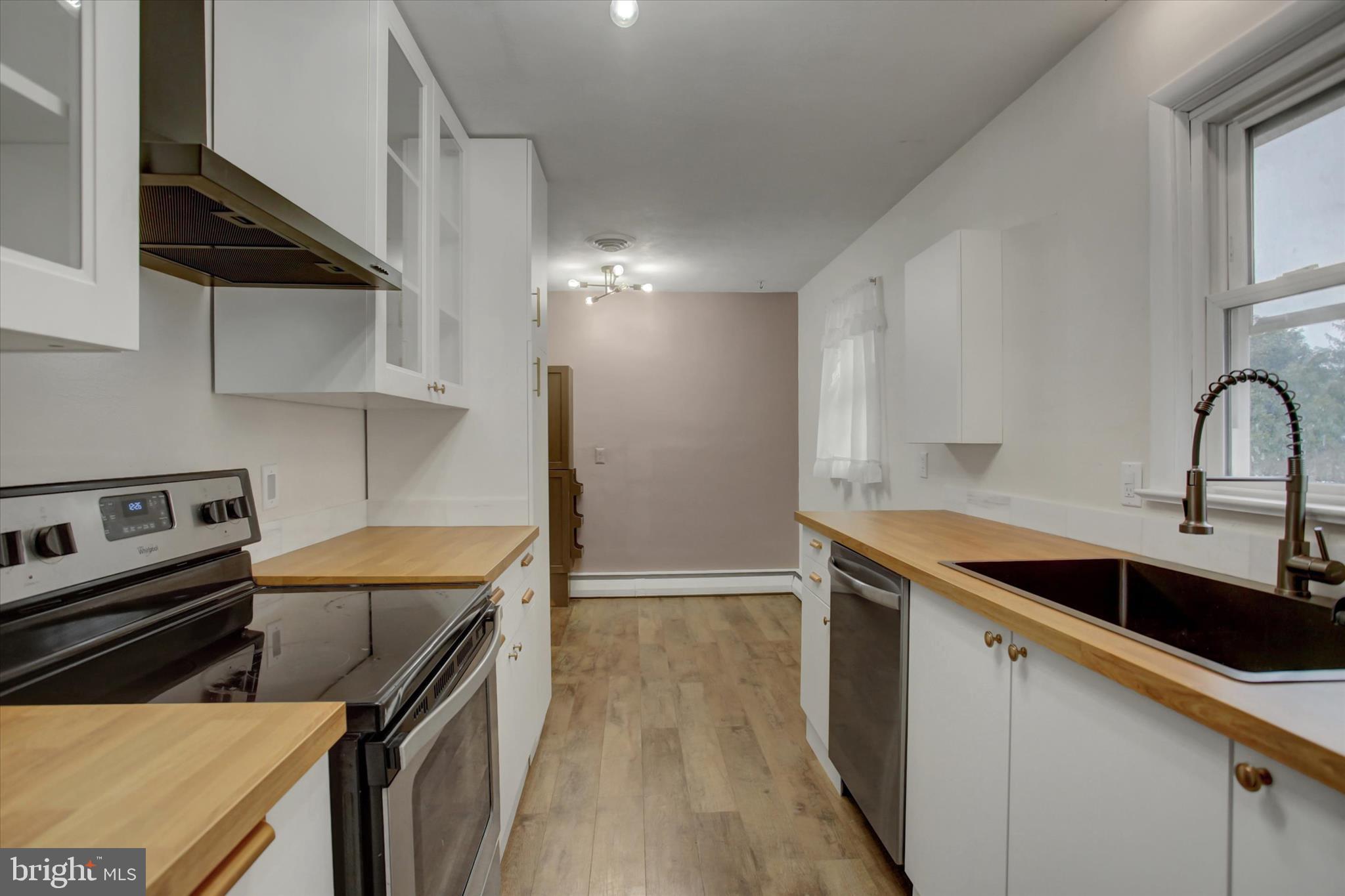 10894 Grindstone Hill Road Greencastle, PA 17225 - Photo 14 of 43 a kitchen that has a sink and a stove