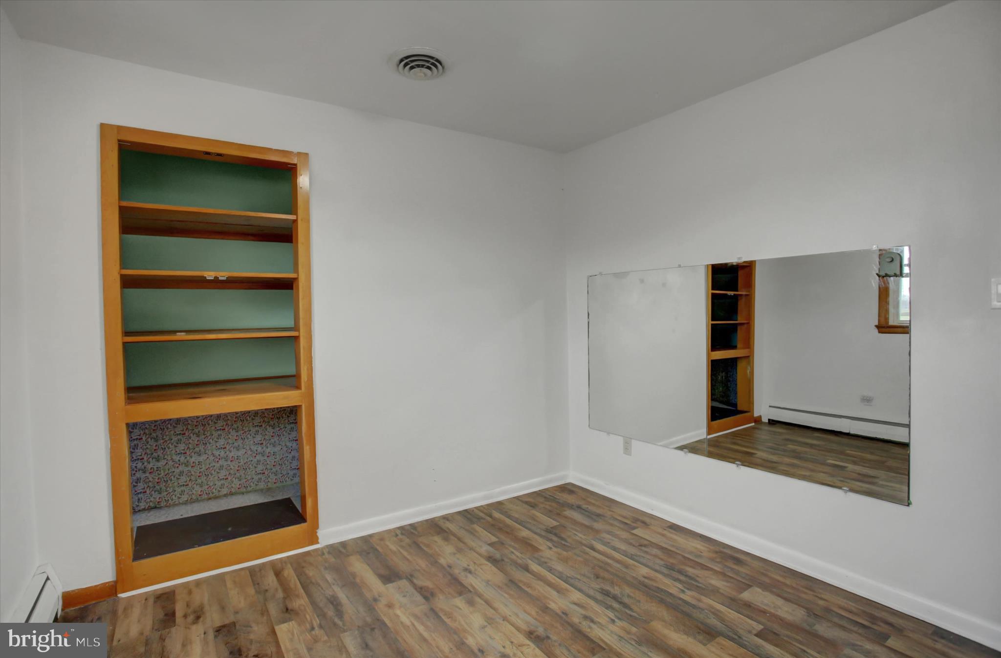 10894 Grindstone Hill Road Greencastle, PA 17225 - Photo 25 of 43 a view of an empty room with wooden floor and a window