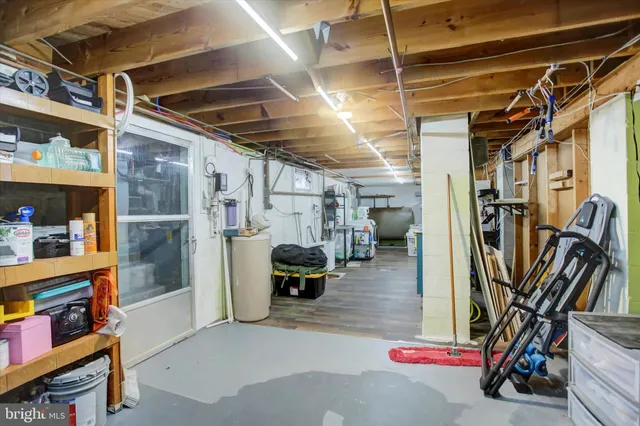 a bedroom with furniture and a gym equipment