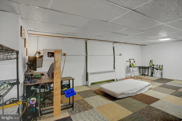 a living room with furniture gym equipment and a view of living room