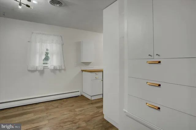 a kitchen with a sink and a refrigerator