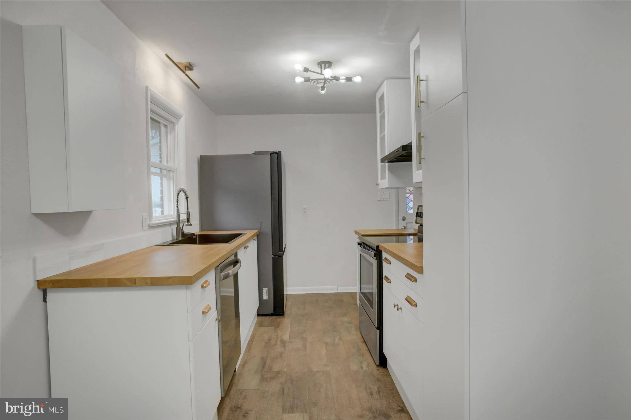 10894 Grindstone Hill Road Greencastle, PA 17225 - Photo 7 of 43 a kitchen with a sink and a refrigerator