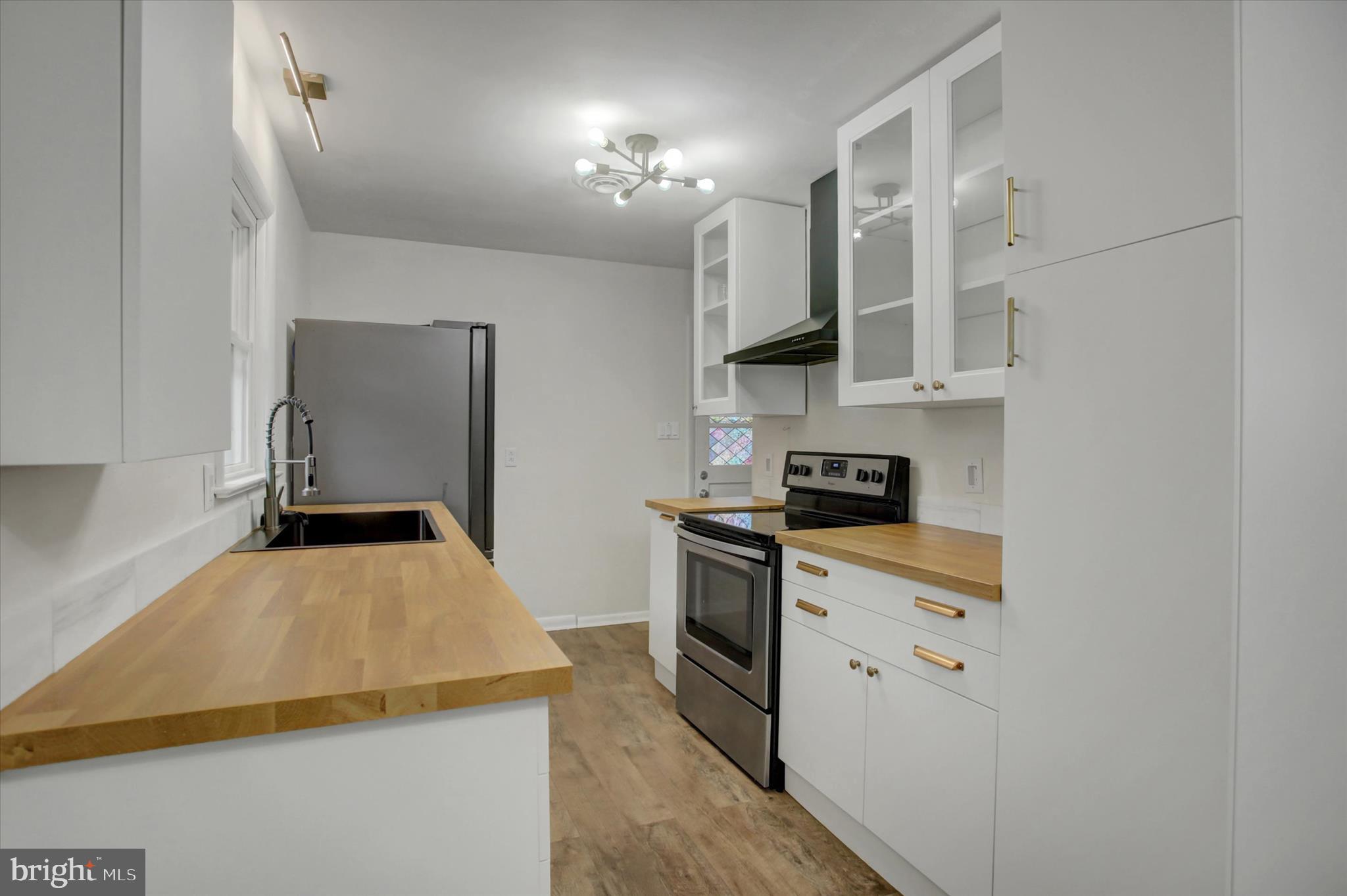 10894 Grindstone Hill Road Greencastle, PA 17225 - Photo 8 of 43 a kitchen with a sink a stove and cabinets