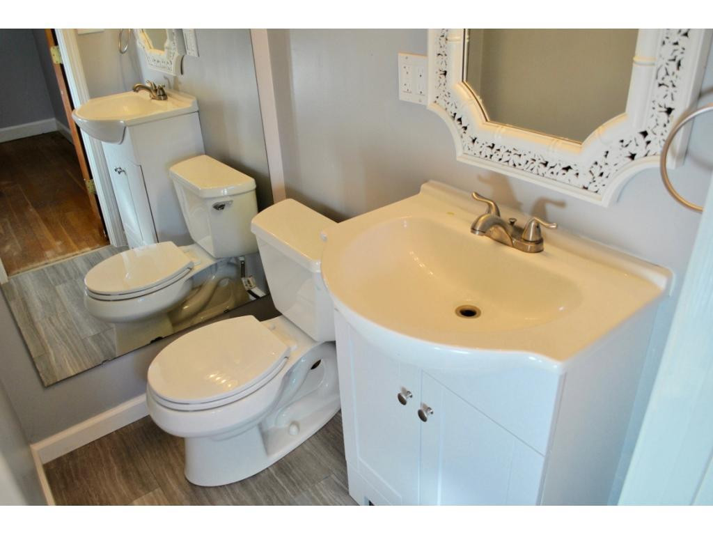 3212 Oak Ridge Road Summerfield, NC 27358 - Photo 11 of 22 a bathroom with a sink and a toilet