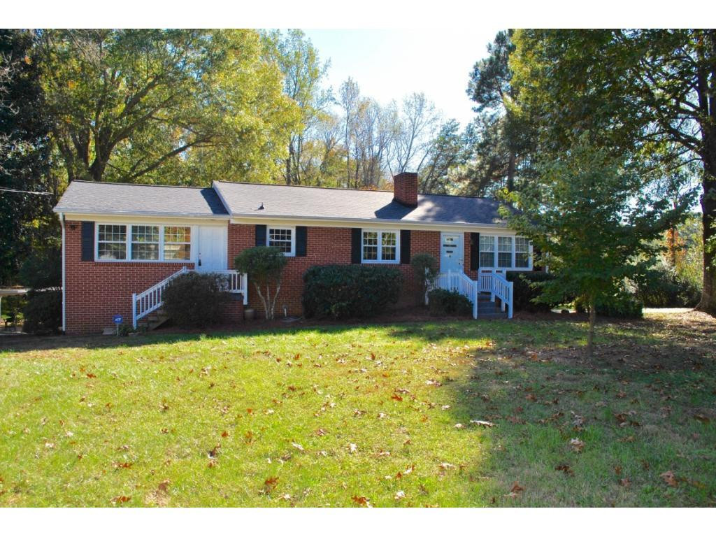 3212 Oak Ridge Road Summerfield, NC 27358 - Photo 22 of 22 a front view of a house with a yard