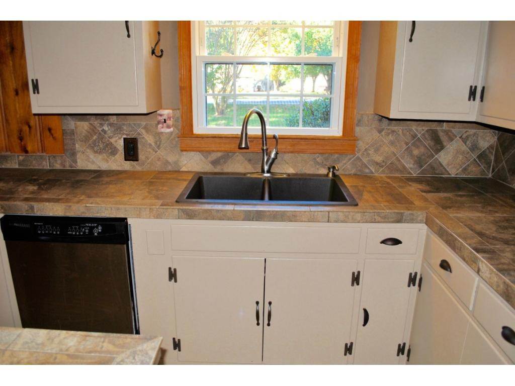3212 Oak Ridge Road Summerfield, NC 27358 - Photo 7 of 22 a kitchen with a sink and a window