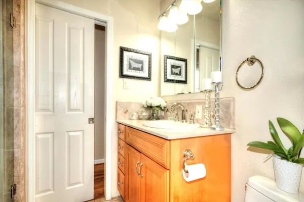 a bathroom with a sink a mirror and a shower