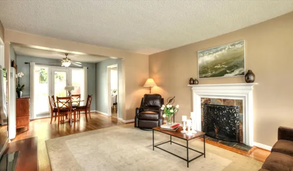 a living room with furniture and a fireplace