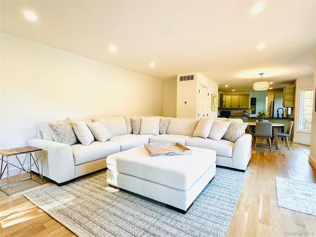 a large bedroom with a bed and a couch