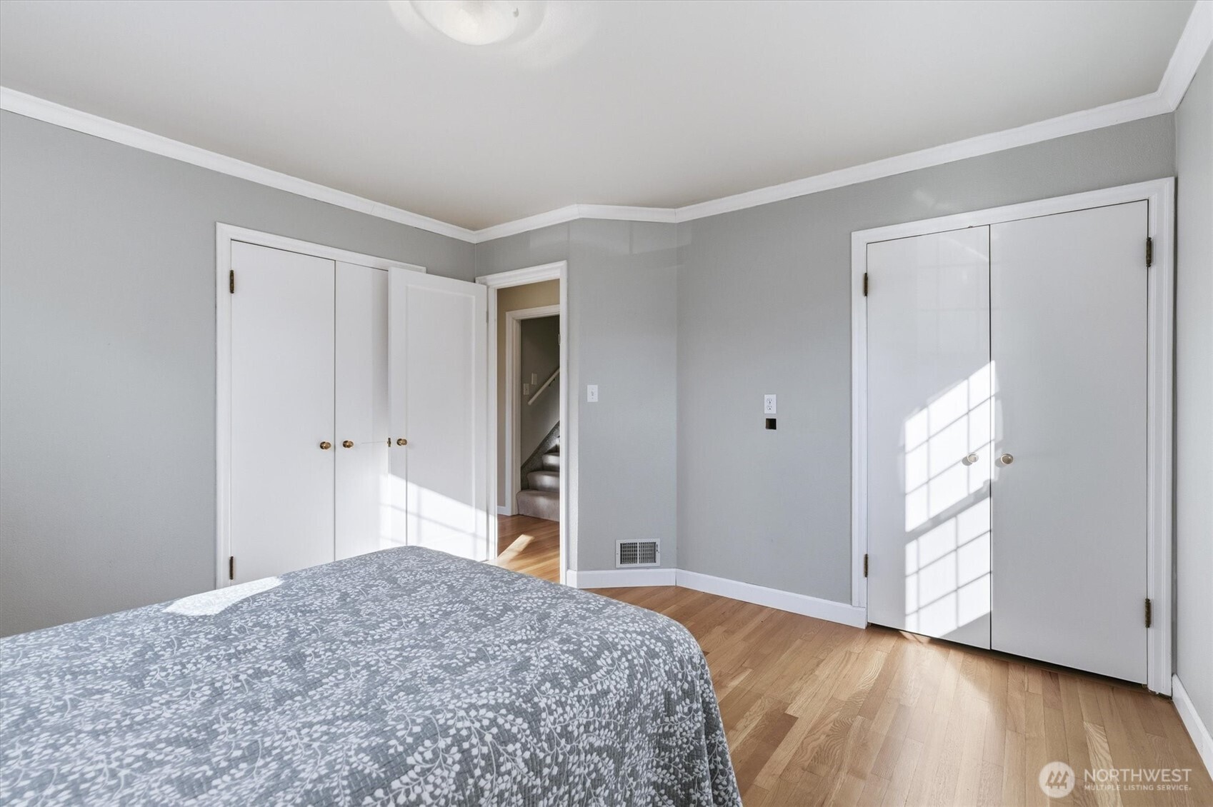 1403 18th Avenue Longview, WA 98632 - Photo 14 of 39 a bedroom with a bed and wooden floor