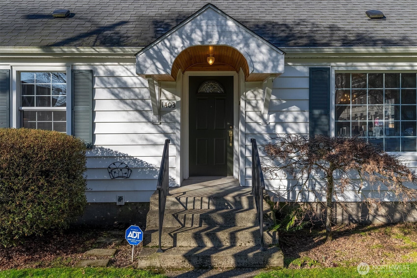 1403 18th Avenue Longview, WA 98632 - Photo 3 of 39 a front view of a house with a yard