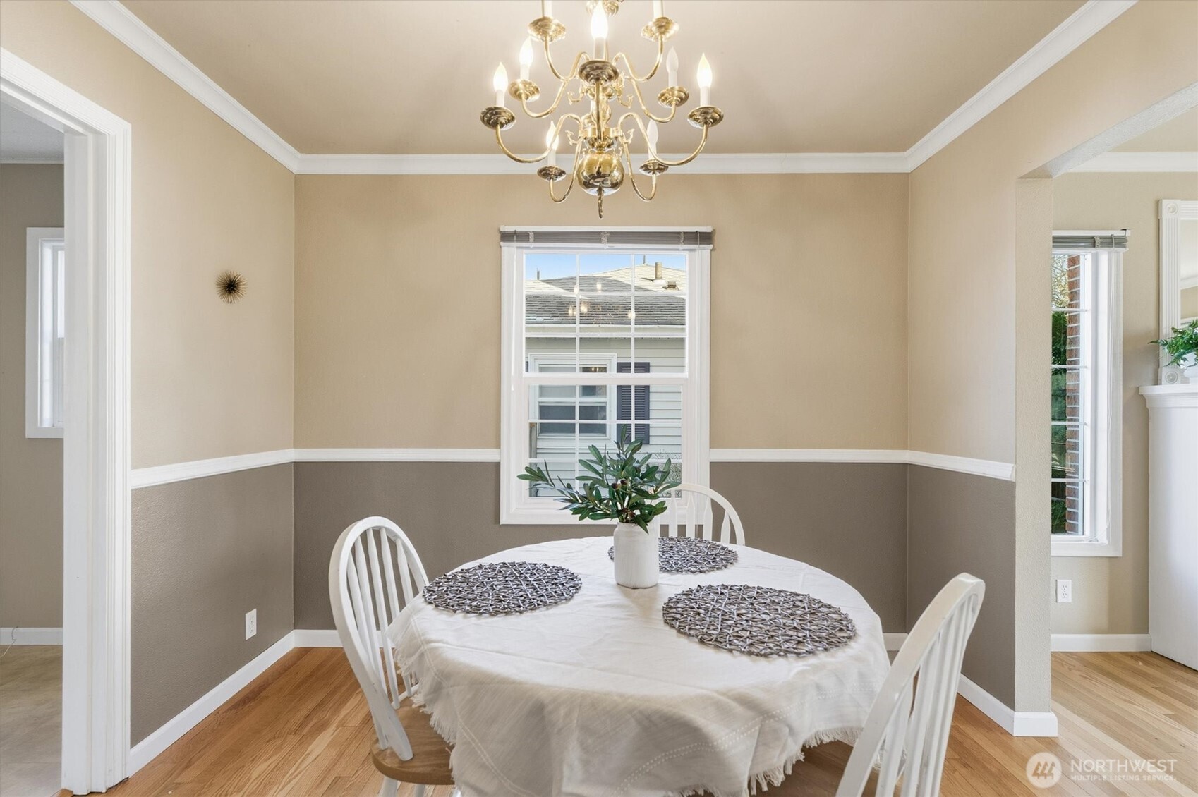 1403 18th Avenue Longview, WA 98632 - Photo 9 of 39 a view of a dining room with furniture a chandelier and wooden floor