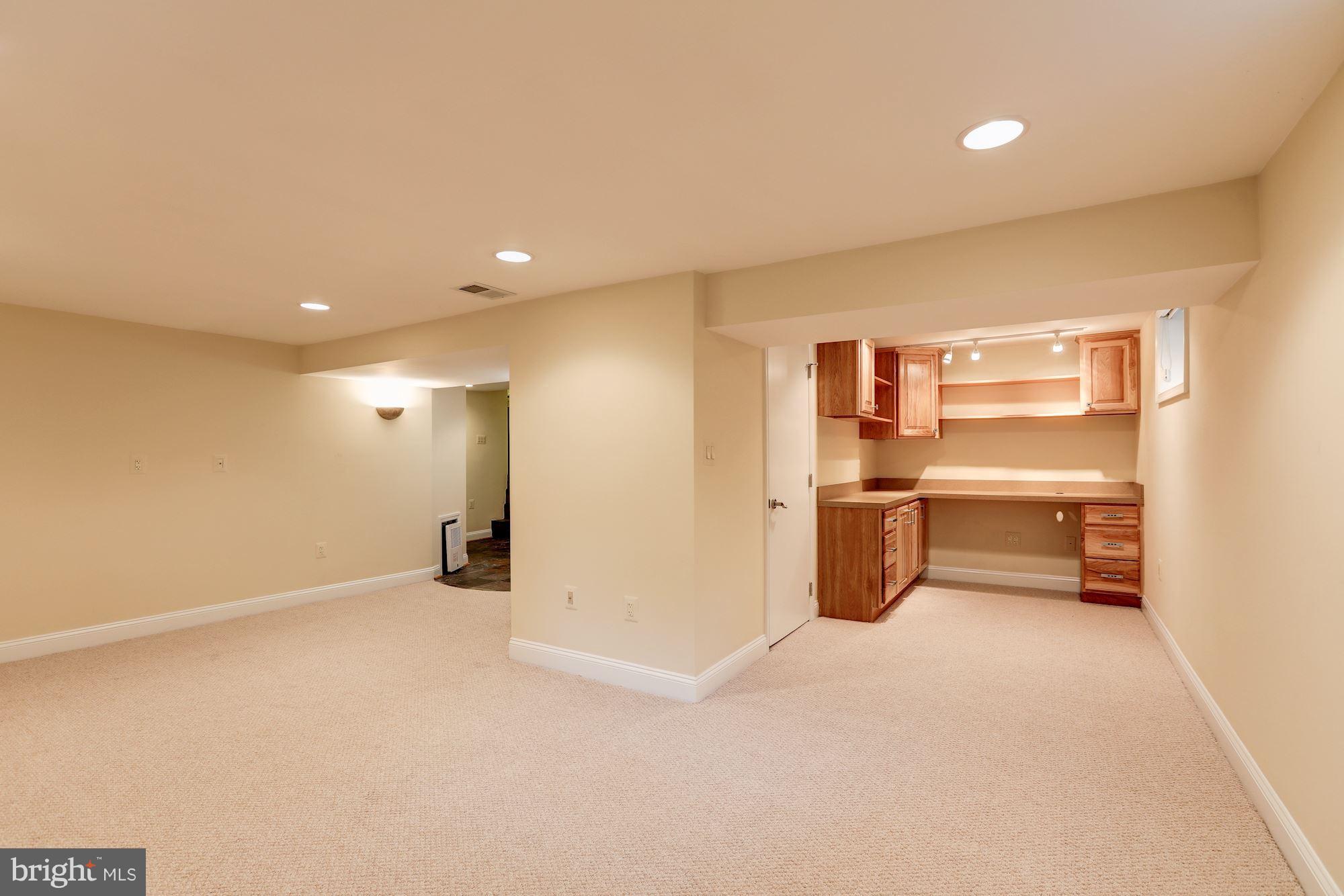 9700 Lorain Avenue Silver Spring, MD 20901 - Photo 23 of 30 Lower Level Family Room with Built-In Work Station