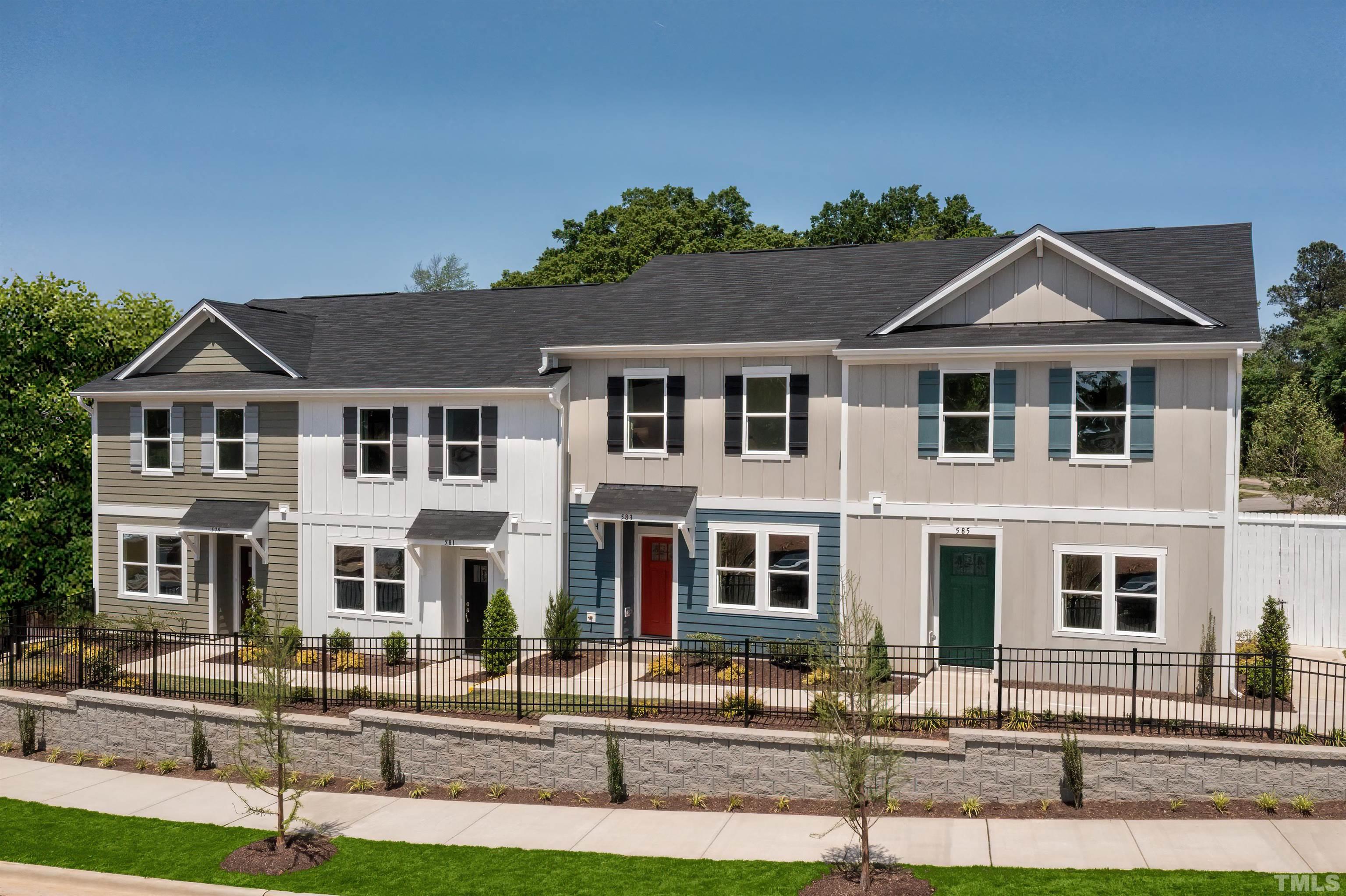 445 Hacksaw Trail Raleigh, NC 27610 - Photo 4 of 5 a front view of residential houses with street