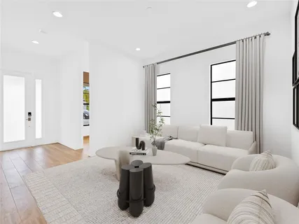 a living room with furniture and window