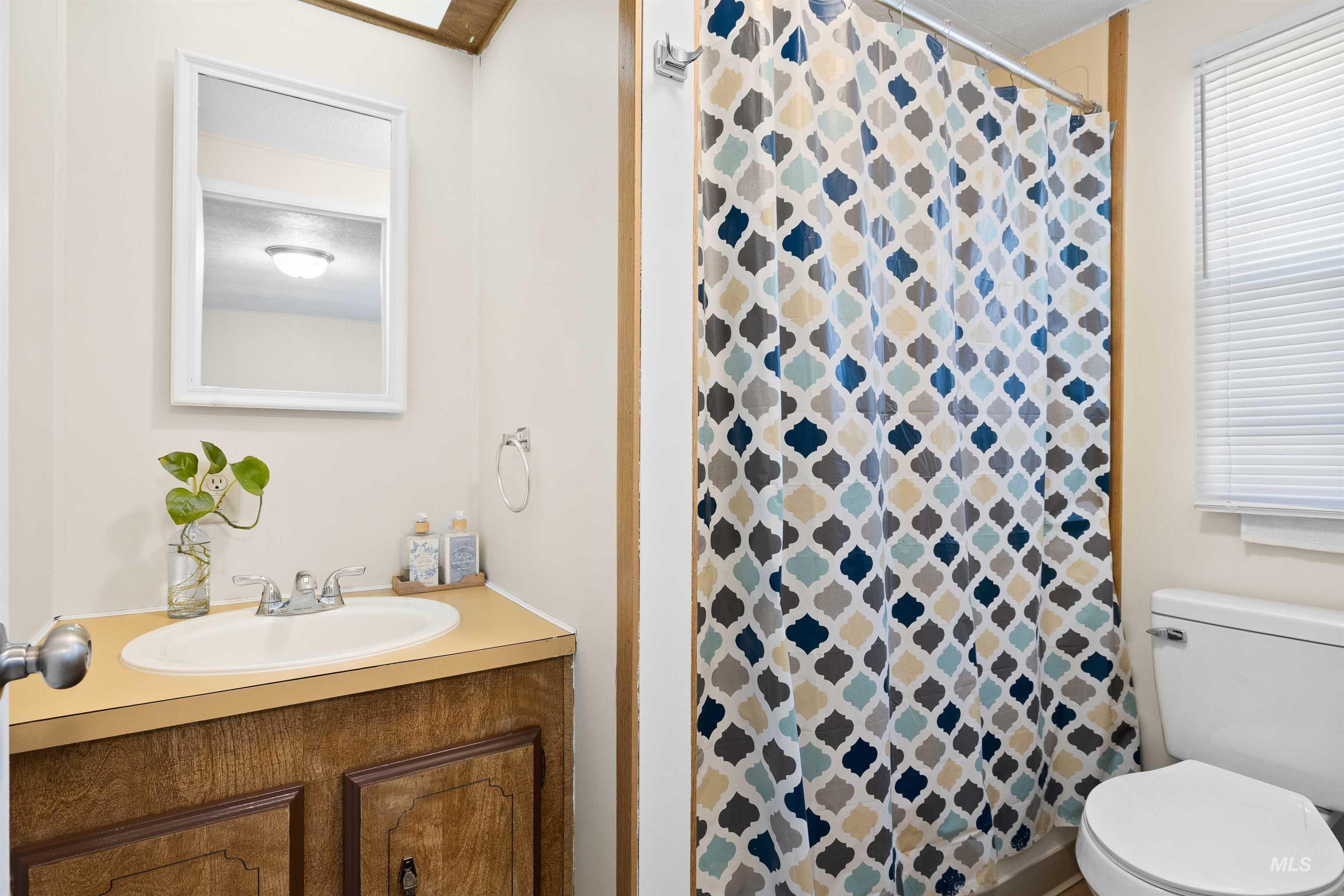 198 South Hills Road, Unit 115 Twin Falls, ID 83301 - Photo 10 of 22 Bathroom with vanity and a shower stall