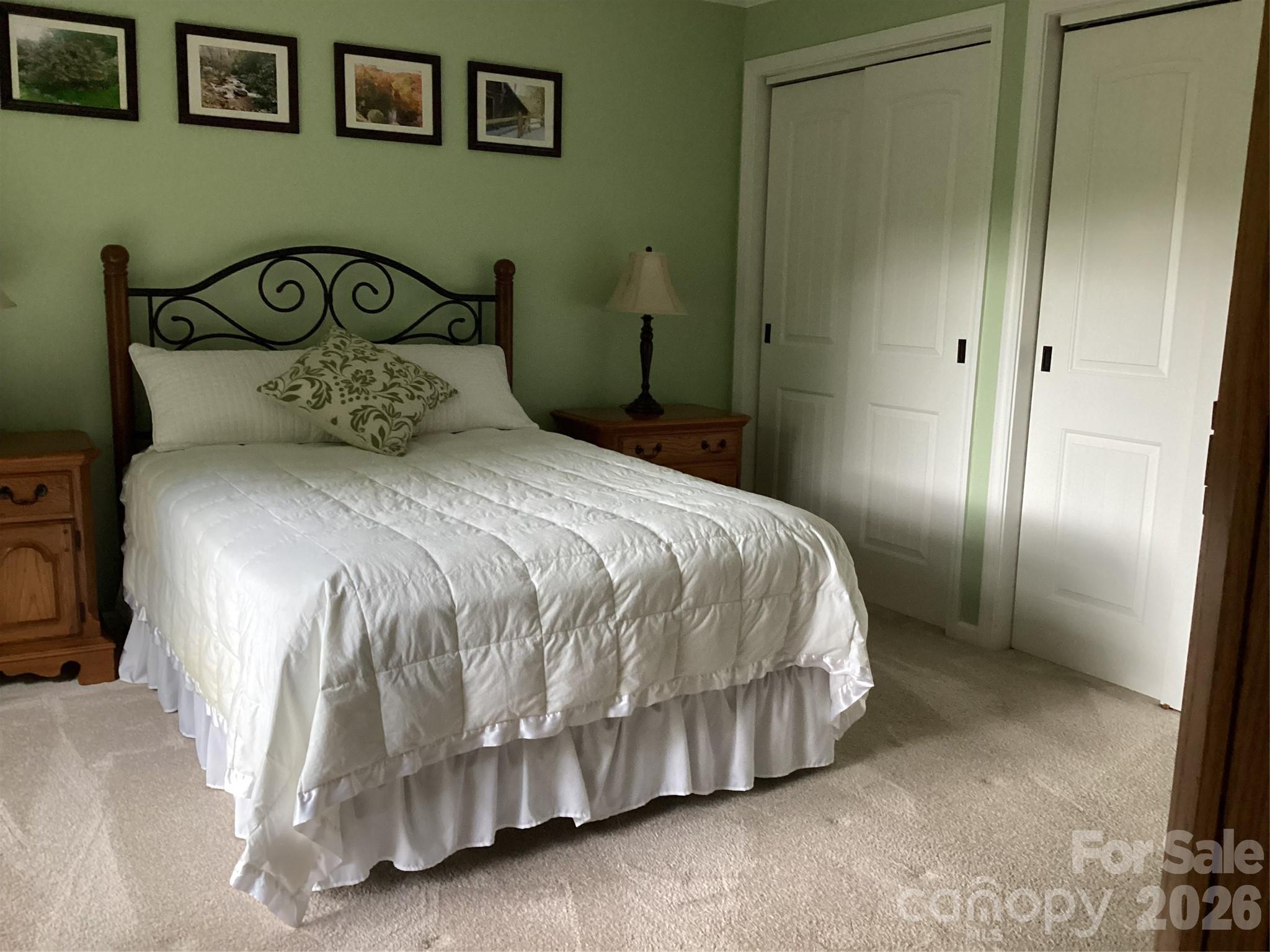 31 Rhododendron Road Black Mountain, NC 28711 - Photo 13 of 27 a large bed sitting in a bedroom next to a bathroom