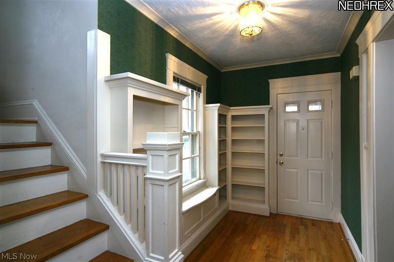 2952 Hampshire Road Cleveland, OH 44118 - Photo 6 of 19 View of the side foyer and the built in bookcases and access to the side porch
