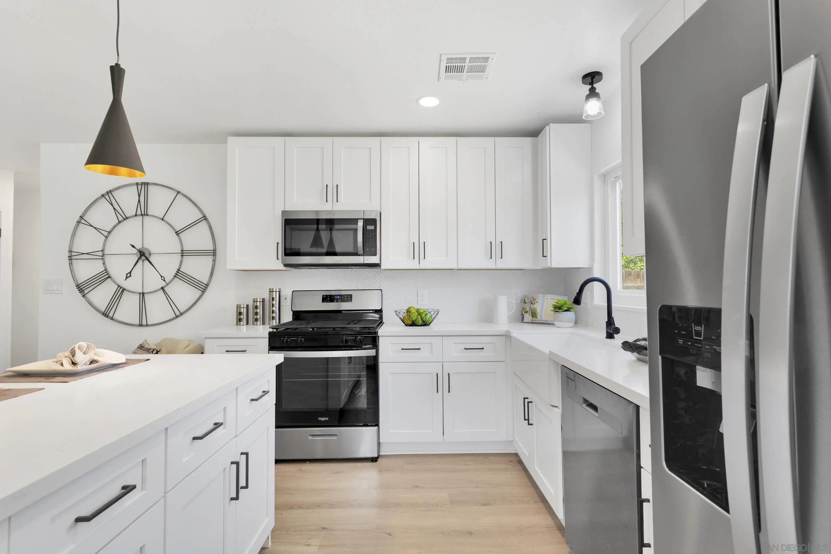 6630 Montclair Drive Riverside, CA 92504 - Photo 13 of 47 a kitchen with stainless steel appliances a stove a sink and a refrigerator