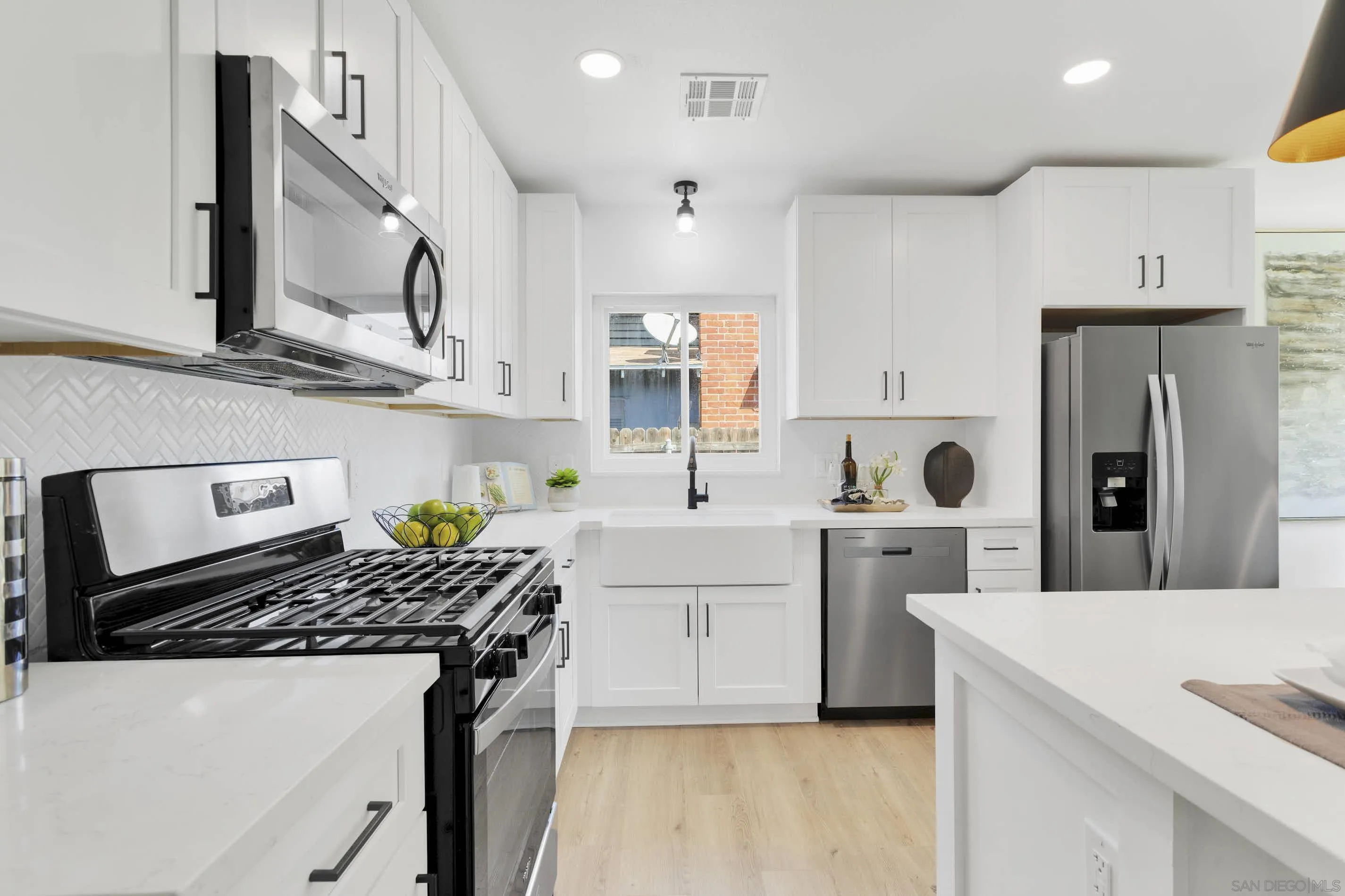 6630 Montclair Drive Riverside, CA 92504 - Photo 14 of 47 a kitchen with cabinets and stainless steel appliances