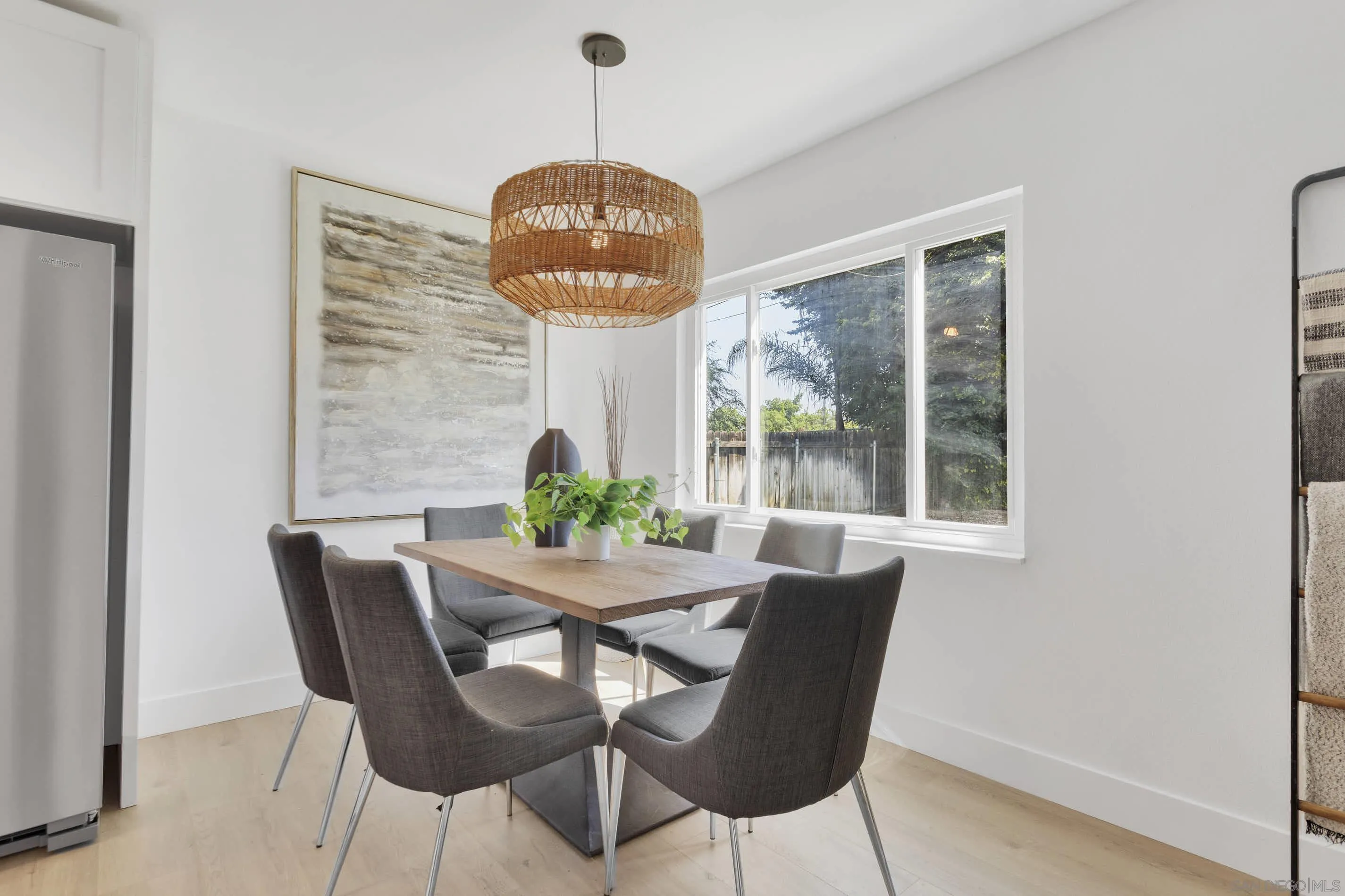 6630 Montclair Drive Riverside, CA 92504 - Photo 17 of 47 a dining room with furniture a chandelier and wooden floor