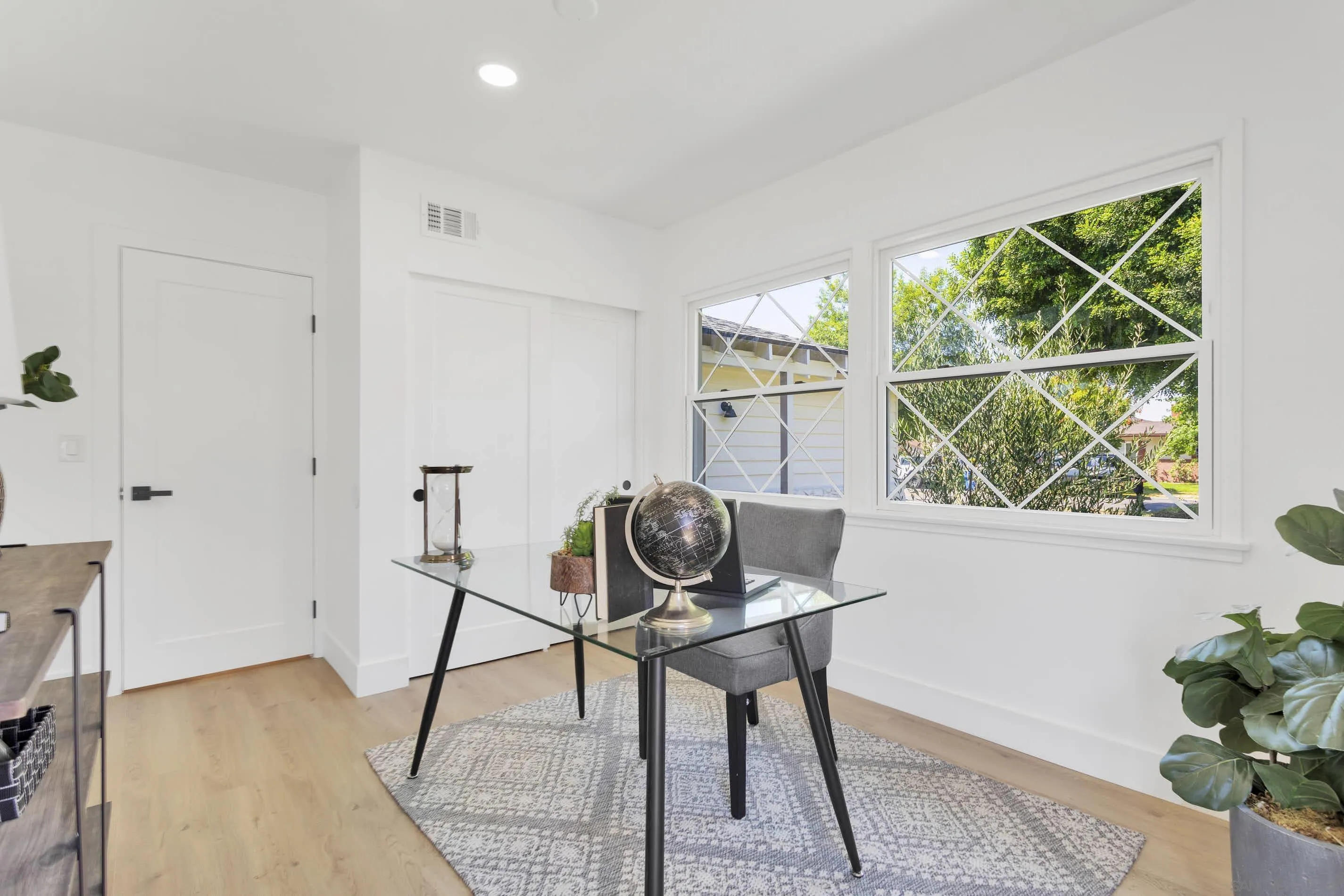 6630 Montclair Drive Riverside, CA 92504 - Photo 19 of 47 a view of a workspace with furniture and a window