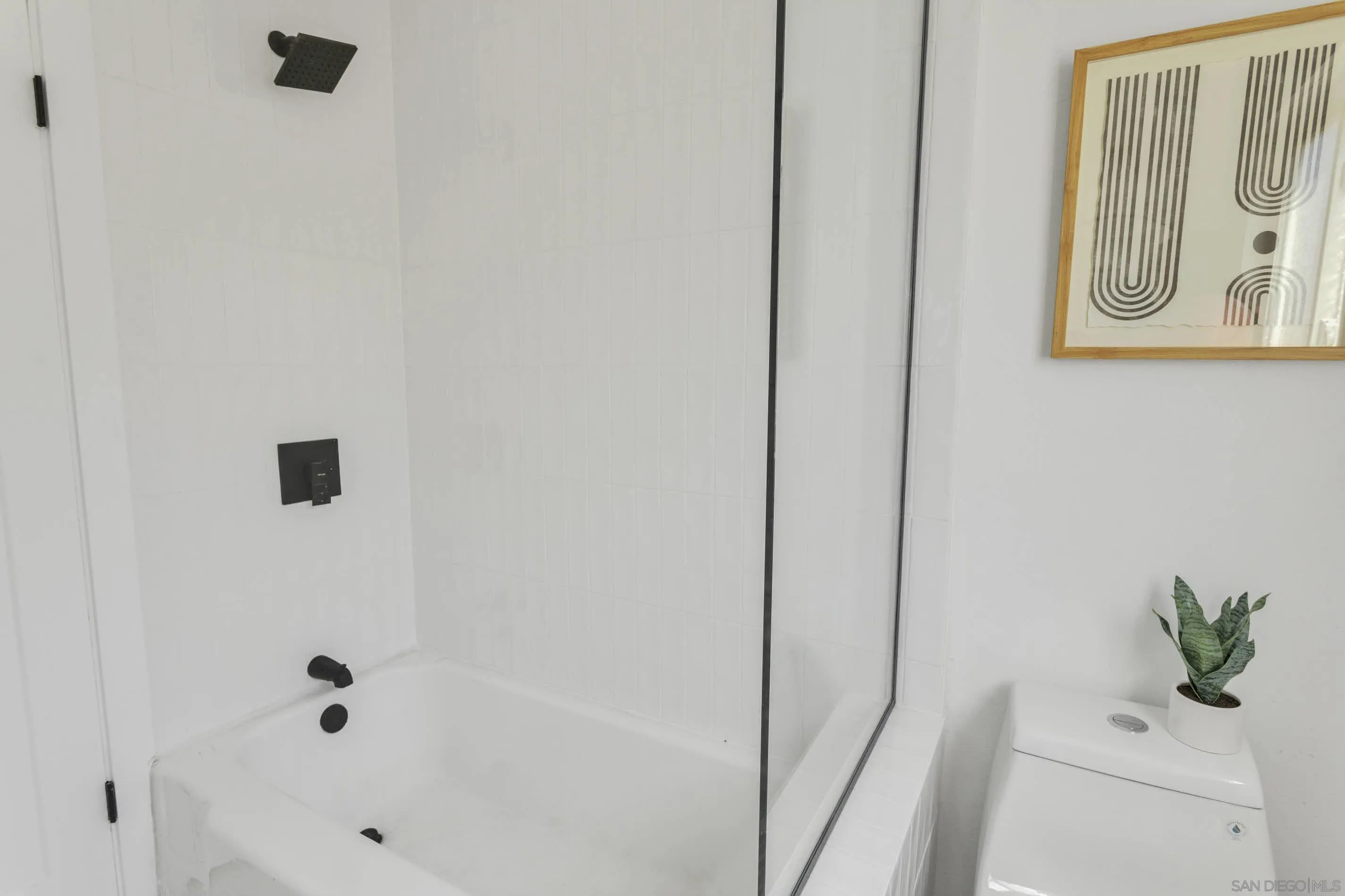 6630 Montclair Drive Riverside, CA 92504 - Photo 23 of 47 a bathroom with a bathtub and a shower