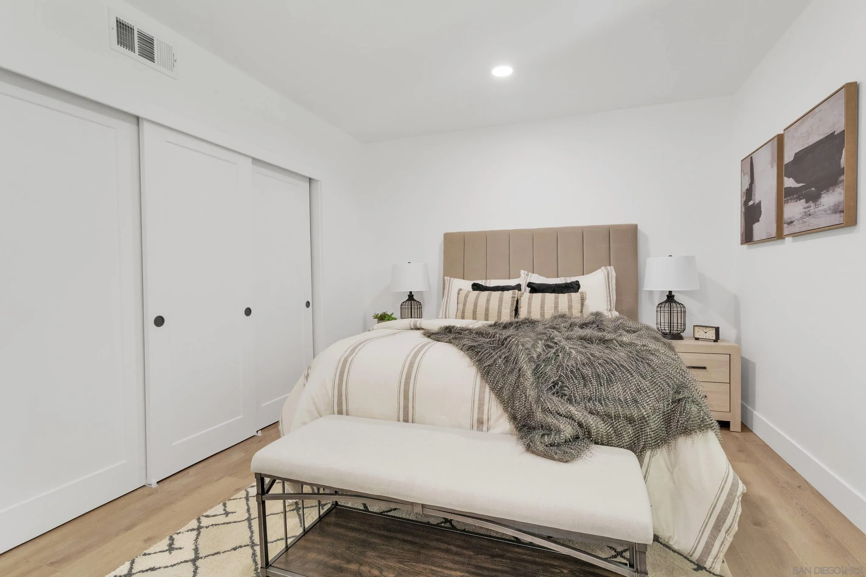6630 Montclair Drive Riverside, CA 92504 - Photo 27 of 47 a bedroom with a bed and wooden floor
