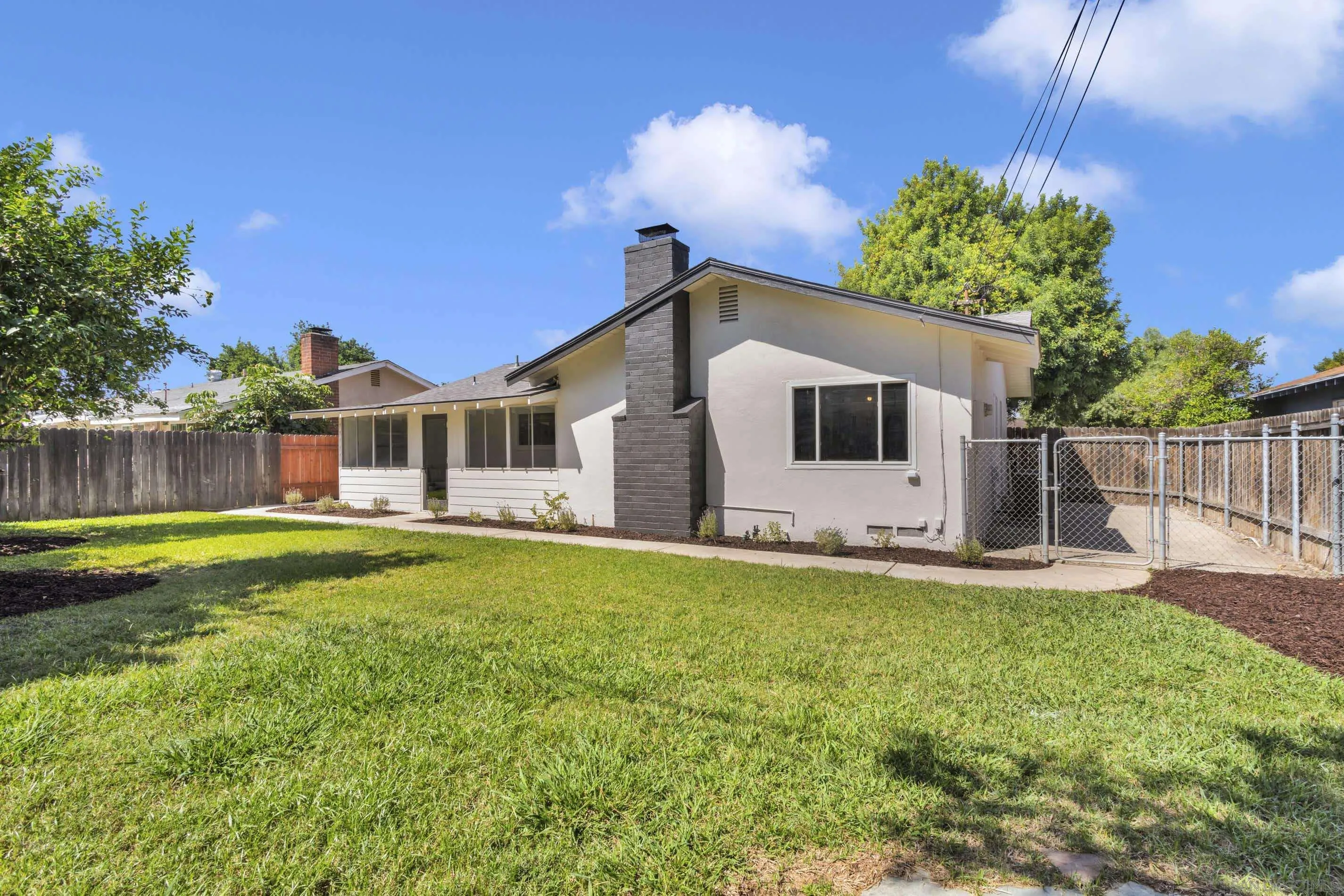 6630 Montclair Drive Riverside, CA 92504 - Photo 42 of 47 a front view of house with yard and outdoor seating