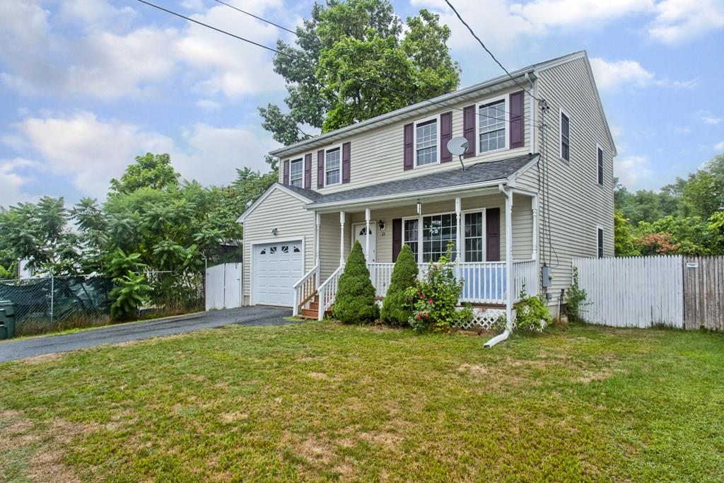 23 Martha Street Springfield, MA 01151 - Photo 1 of 19 a view of a house with a yard and sitting area