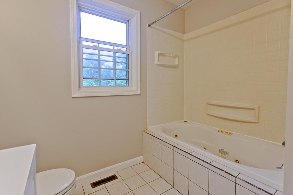 23 Martha Street Springfield, MA 01151 - Photo 14 of 19 a bathroom with a bathtub and toilet