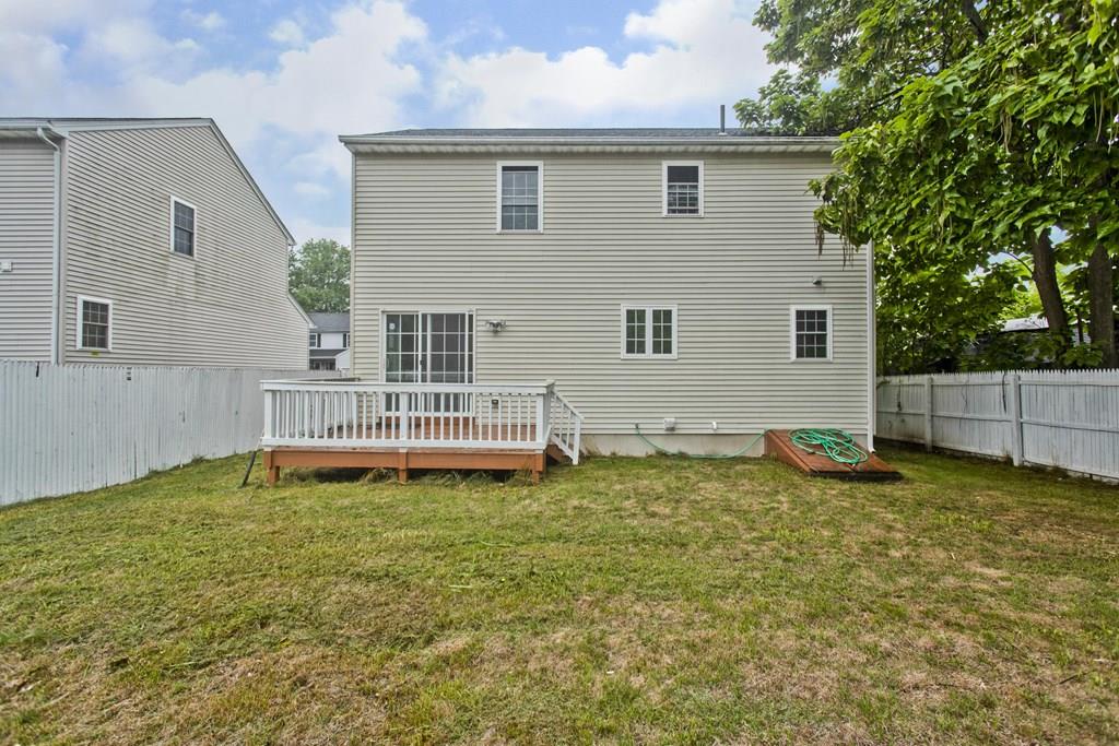 23 Martha Street Springfield, MA 01151 - Photo 18 of 19 a backyard of a house with table and chairs
