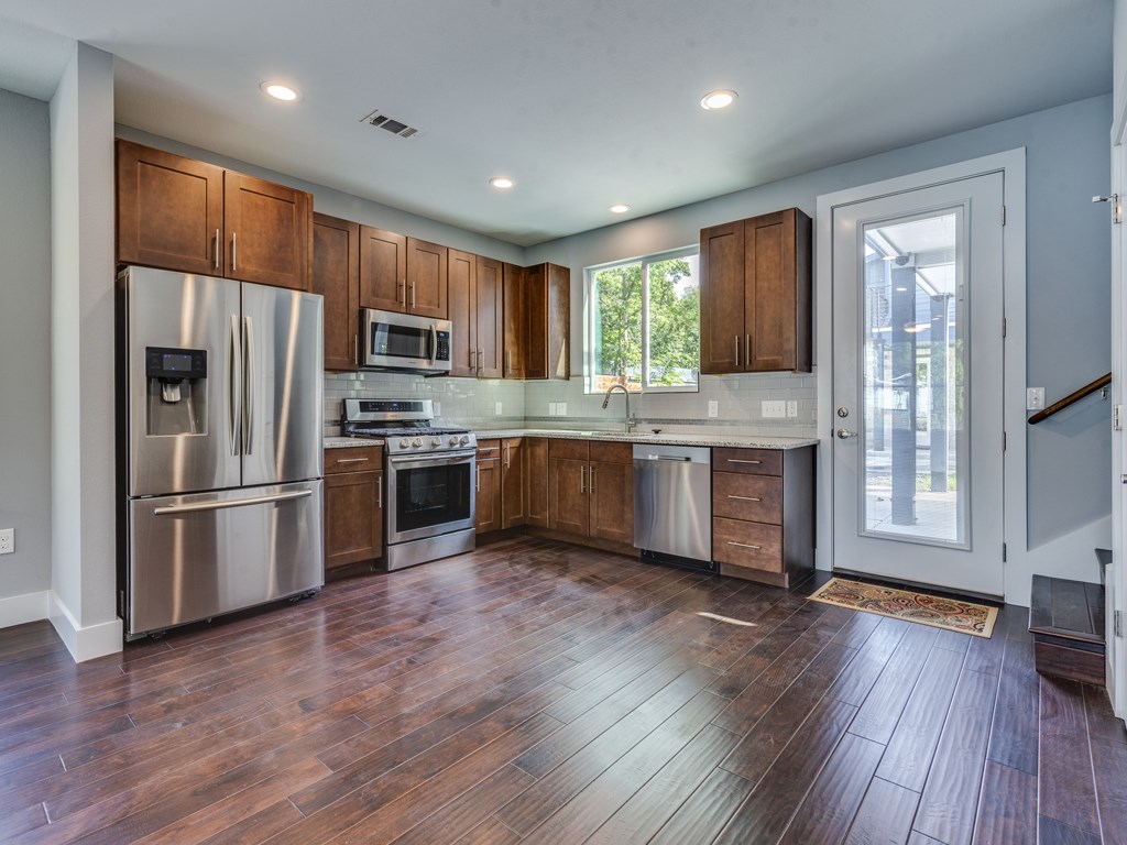 406 Post Rd Drive, Unit 1 Austin, TX 78704 - Photo 5 of 30 kitchen with beautiful cabinets and stainless steel appliances
